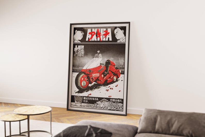 May include: Framed poster featuring a manga-style illustration. The artwork showcases a red motorcycle with the word "Canon" on it, set against a black and white background. The title "AKIRA" is displayed at the top.