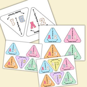 May include: A set of nine colorful triangle shaped cards with numbers and letters printed on them. The cards are designed to help children learn about partners and teamwork.