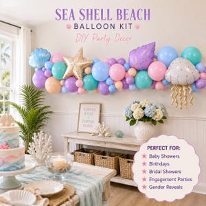 May include: A Sea Shell Beach balloon kit featuring a garland of blue, purple, pink, and peach balloons, including foil balloons shaped like a seashell, a gold starfish, a purple conch shell, and a white jellyfish with gold dangling tentacles.