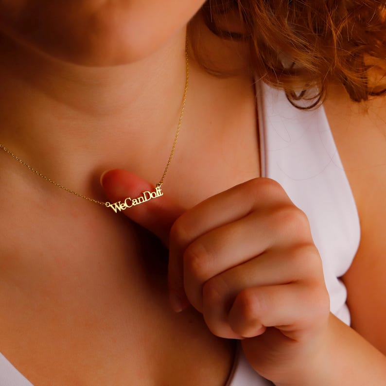 we can do it necklace; inspired quote jewelry; women empowerment gift; gold filled word charm; dainty feminist necklace; bold statement jewelry; personalized chain for her; motivational gold necklace; 925 sterling silver pendant; custom phrase jewelry; waterproof necklace with message; gift for boss babe; modern empowering jewelry; heartfelt gift for strong girls; inspirational minimalist necklace