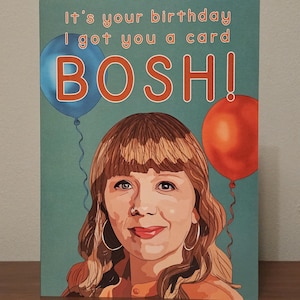 May include: Birthday card featuring a woman's portrait, two balloons, and the text "It's your birthday I got you a card BOSH!". The card has a teal background and orange and blue accents.