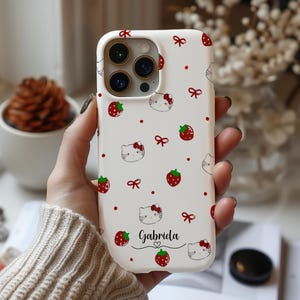 Clear MagSafe-compatible iPhone case featuring a cartoon cat-inspired design with a customizable name detail, slim protective edges, and a smooth glossy finish for daily use.