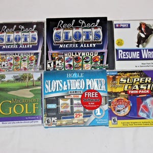 May include: A collection of six PC CD-ROM software cases including Reel Deal Slots Nickel Alley, Resume Writer, Microsoft Golf, Hoyle Slots & Video Poker, and Las Vegas Super Casino Twin Pack, featuring various colorful graphic designs and text.