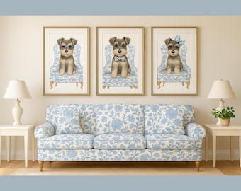 Pode incluir: Três impressões emolduradas de filhotes de Schnauzer, cada um usando acessórios e sentado em uma cadeira floral azul. Abaixo das impressões, há um sofá floral azul correspondente, criando um design de sala coordenado. As impressões estão em molduras douradas.