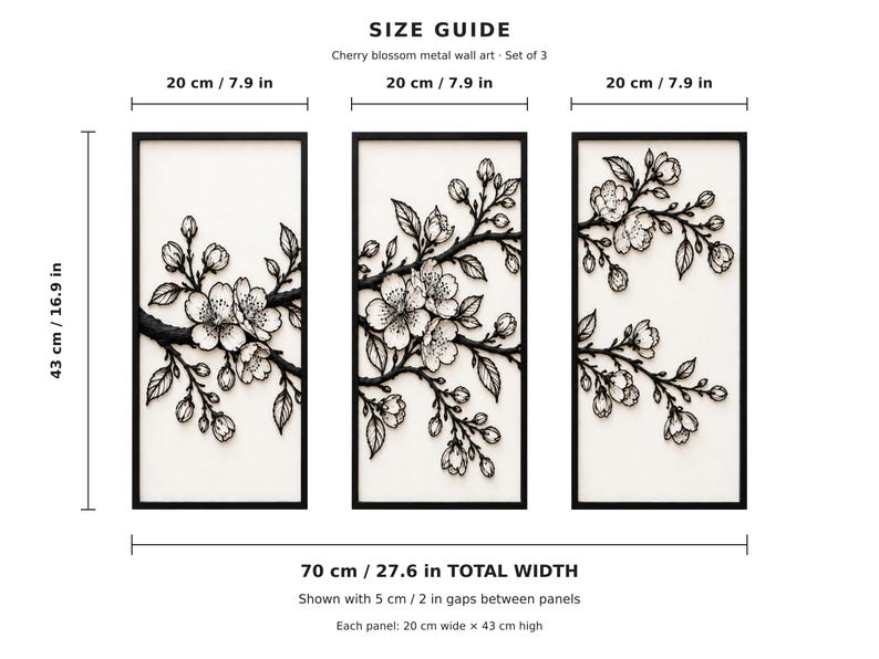 May include: A set of three rectangular metal wall art panels featuring black cherry blossom branches on a white background. Each panel measures 7.9 inches wide by 16.9 inches high, with a total width of 27.6 inches including 2-inch gaps.
