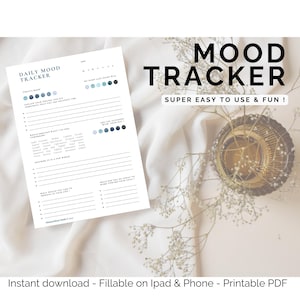 May include: A white Daily Mood Tracker printable PDF with blue accents. The text "MOOD TRACKER" is displayed in large black letters. The text "SUPER EASY TO USE & FUN!" is below the title. The bottom of the image reads "Instant download - Fillable on Ipad & Phone - Printable PDF".
