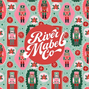 May include: A repeating pattern featuring Christmas nutcrackers in red, pink, and green on a light teal background. The design includes poinsettias and snowflakes. A red circle with the text "River Mabel Co" is in the center.