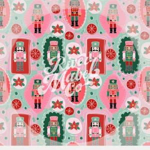 May include: A repeating pattern featuring colourful nutcracker soldiers in red, green, and pink. The design includes poinsettias, snowflakes, and decorative oval frames. The background is a light pink colour.