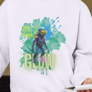 光る宇宙飛行士のグラフィティシャツデザイン – TシャツとPOD用のデジタルダウンロード