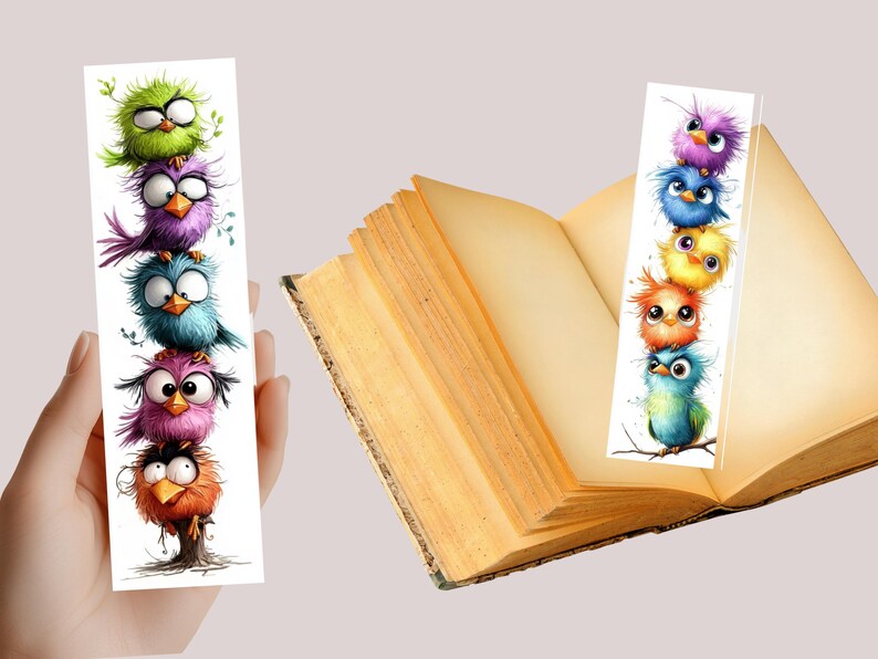 May include: Two whimsical bookmarks featuring cartoon birds. One bookmark is held by a hand, the other is placed in an open book. The birds are in various colors, including green, purple, blue, pink, orange, and yellow. The bookmarks are white with a glossy finish.