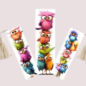 May include: Three whimsical bookmarks featuring stacks of cartoon birds in vibrant colors. Each bookmark has a white tassel. The birds are in shades of pink, orange, green, blue, and yellow, with large, expressive eyes.
