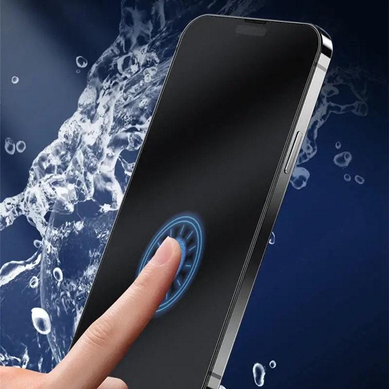 May include: A black smartphone with a fingerprint sensor on the screen. The phone is submerged in water, with water droplets visible on the screen.