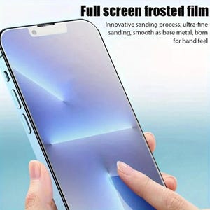 May include: A frosted phone screen protector is being applied to a smartphone. The screen protector is designed to provide a smooth, glass-like feel.