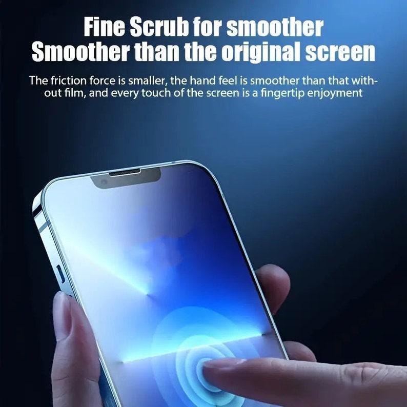 May include: A close-up of a smartphone screen with a finger touching the screen. The screen is lit up with a blue glow. The text on the screen reads "Fine Scrub for smoother Smoother than the original screen". The friction force is smaller, the hand feel is smoother than that without film, and every touch of the screen is a fingertip enjoyment.