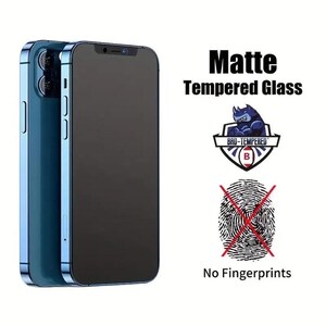 May include: A matte tempered glass screen protector for a smartphone. The screen protector is designed to prevent fingerprints and scratches. The image shows the screen protector on a blue smartphone.