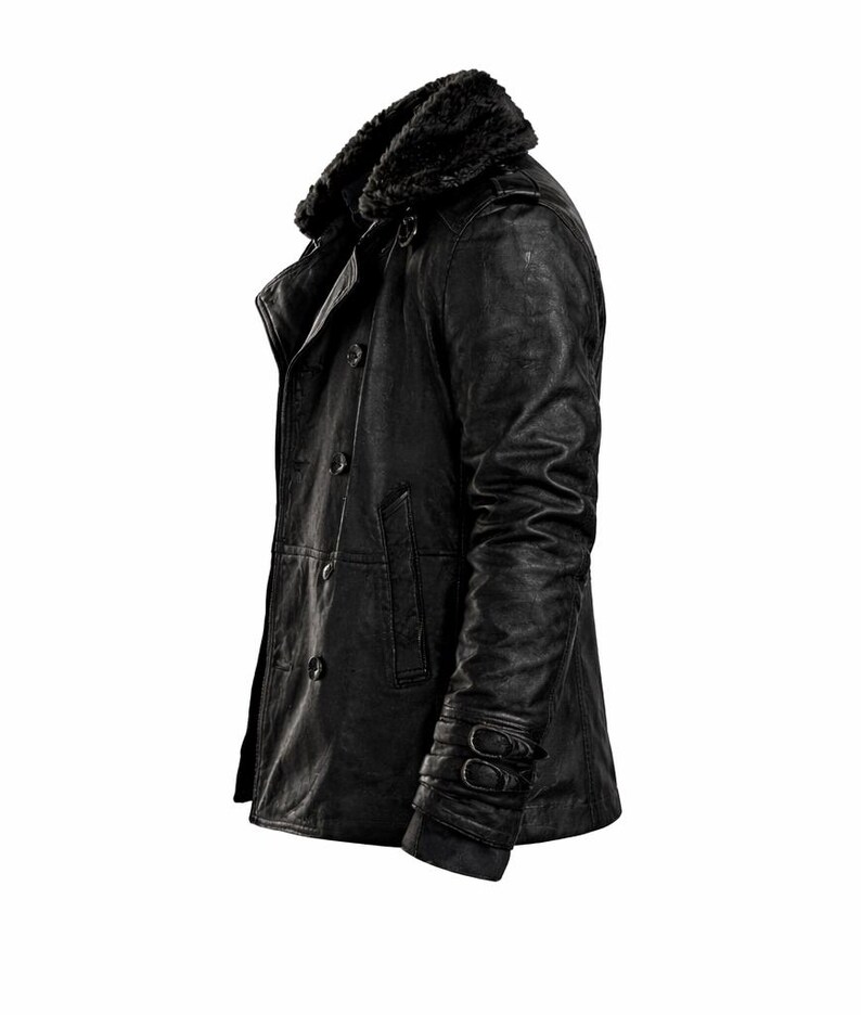 May include: Black leather jacket with a faux fur collar. The jacket features a double-breasted design with multiple buttons, a notched lapel, and a textured finish. The sleeves have buckle details near the cuffs. A classic outerwear piece.