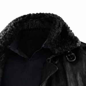 May include: A black leather jacket with a faux fur collar. The jacket has a button closure and a buckle detail on the shoulder. The collar is a dark, textured material.