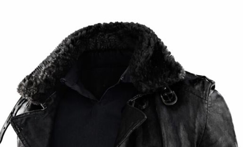 May include: A black leather jacket with a faux fur collar. The jacket has a button closure and a buckle detail on the shoulder. The collar is a dark, textured material.