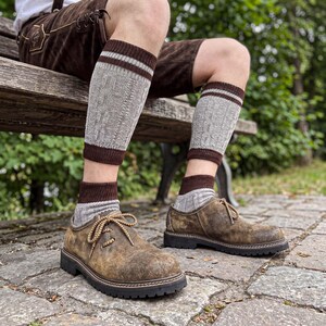 Antiqued brown Bavarian shoes worn with traditional Oktoberfest lederhosen and socks.