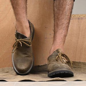 Rustic brown suede leather Bavarian shoes showing front shape and lace detail