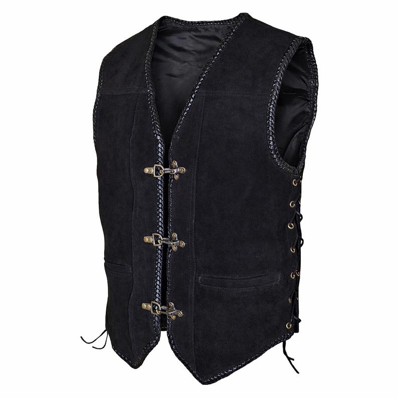 Angled studio view of a black suede leather biker vest positioned slightly to the right, showing depth and structure. The triple hook front closure and braided edge detailing are visible along with the side lacing adjustment. Clean white background enhances focus on the premium cowhide suede texture and craftsmanship.