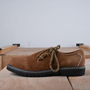 Golden brown bavarian shoes for men side view suede texture traditional footwear