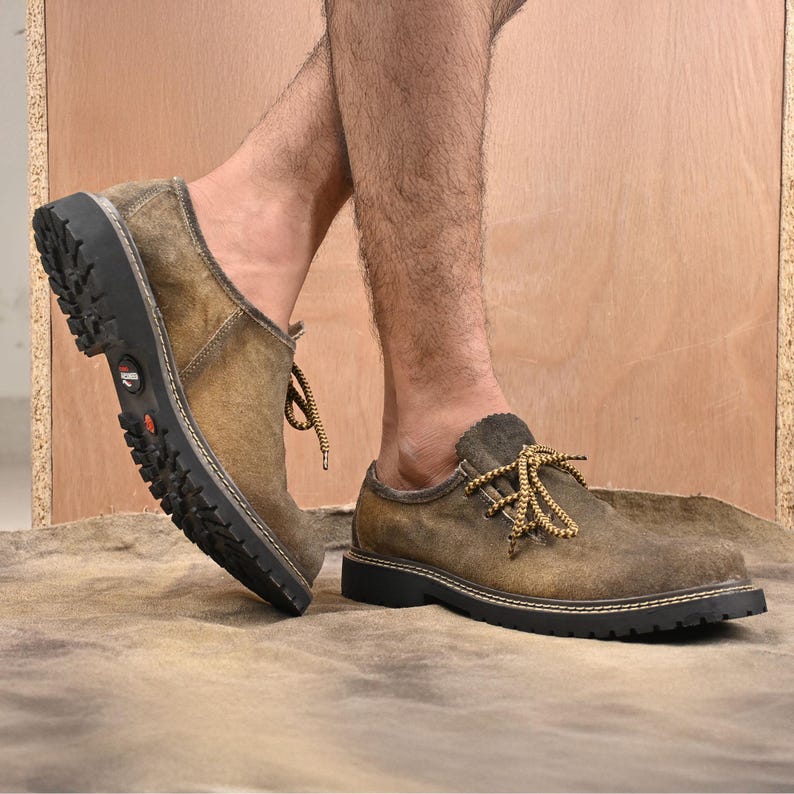 Traditional Bavarian suede leather shoes for men shown worn for indoor walking