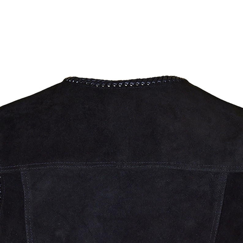 May include: Close-up of a black suede jacket collar. The collar is trimmed with a decorative, stitched design. The jacket has a classic, tailored look, with visible seams and a soft, textured appearance. The overall style suggests a focus on quality and craftsmanship.
