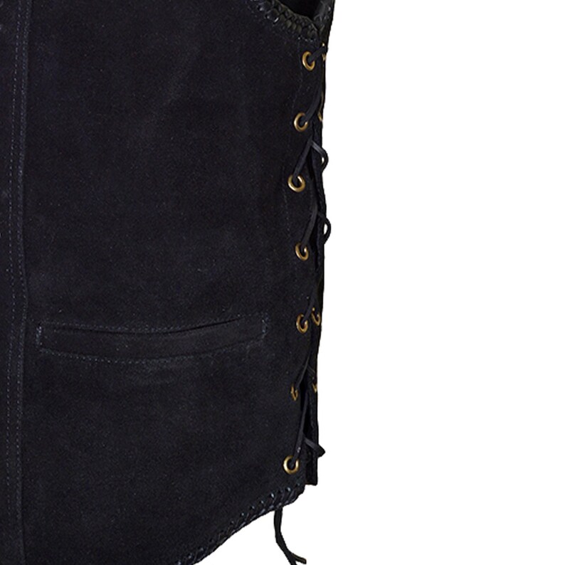 May include: Close-up of a black suede vest with a pocket and lace-up detailing. The vest has a classic design with brass-colored eyelets and a decorative stitched edge. The vest is a dark, solid color.