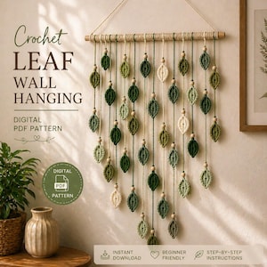 May include: A crochet leaf wall hanging in various shades of green and cream, suspended from a wooden dowel. The leaves are strung with twine and wooden beads. The text on the image says "Crochet Leaf Wall Hanging" and "Digital PDF Pattern".