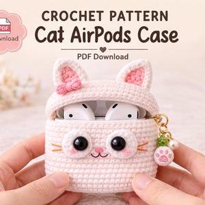 May include: A light pink crochet Cat AirPods Case with black eyes, orange whiskers, and pink ears. The case is open, revealing white AirPods. The text "CROCHET PATTERN Cat AirPods Case" is at the top.