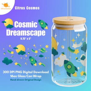 May include: A clear glass can-shaped wrap with a bamboo lid, straw, and a cosmic dreamscape design. The design includes rockets, planets, stars, and moons. The text "Cosmic Dreamscape" is displayed, along with the dimensions 9.75" x 5".