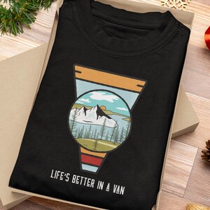 May include: Black t-shirt with a retro-style illustration of a mountain landscape inside a van. The text "Life's Better in a Van" is printed below the illustration.