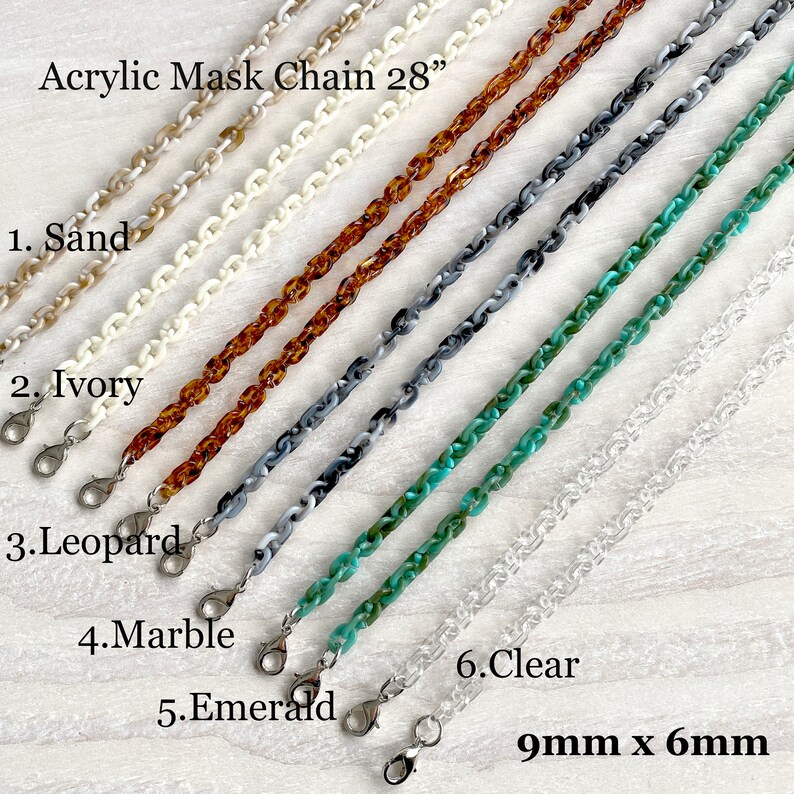May include: Acrylic mask chain in six different colors: sand, ivory, leopard, marble, emerald, and clear. The chain is 28 inches long and measures 9mm x 6mm.
