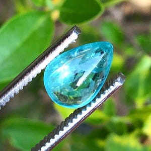 2.55 carats Neon Blue tourmaline cabochon .