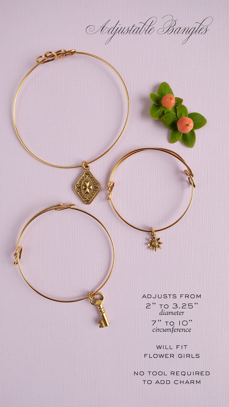 May include: Three gold adjustable bangles with charms. The bangles adjust from 2 to 3.25 inches in diameter and 7 to 10 inches in circumference. The charms are a key, a flower, and a decorative design.  "ADJUSTS FROM 2" TO 3.25" diameter 7" TO 10" circumference WILL FIT FLOWER GIRLS NO TOOL REQUIRED TO ADD CHARM"