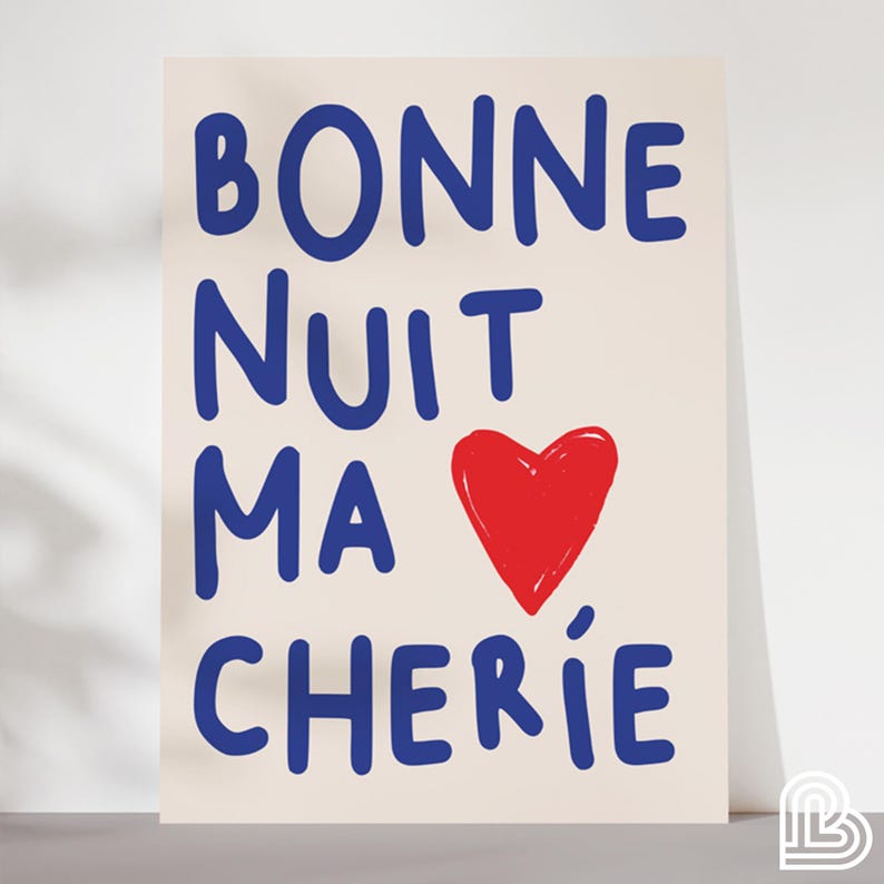 May include: A beige background with the text "BONNE NUIT MA CHERIE" in blue lettering. A red heart is in the center of the text.