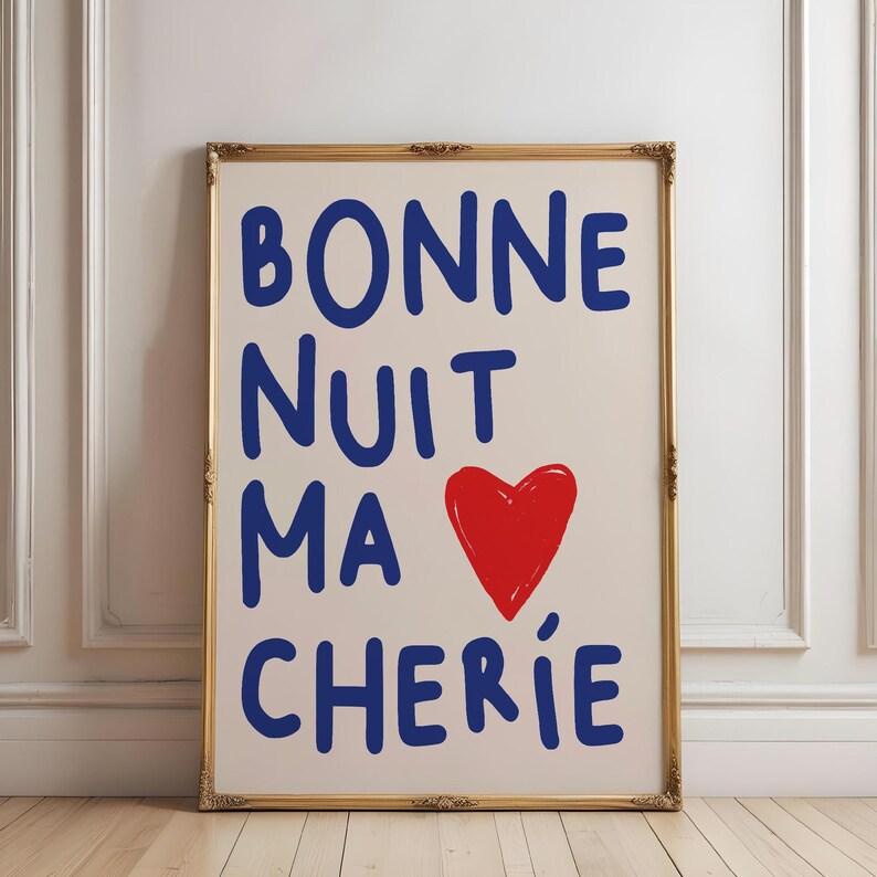May include: A framed print with the text "BONNE NUIT MA CHERIE" in blue lettering and a red heart in the center.