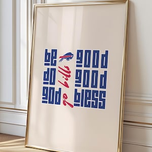 Puede incluir: Impresión artística enmarcada con un marco metálico dorado. La obra de arte presenta las palabras "be good do good go bills good good bless" en texto azul y rojo. También se incluye el logotipo de los Buffalo Bills.