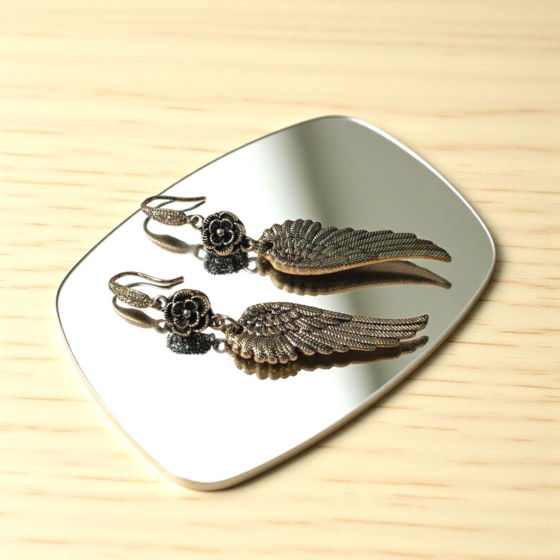 Gift Idea Collection Silver Angel Wing Earring Bohemian Dangle Design Floral Charm Accent Lightweight Statement Piece Wedding Guest Accessory Party Wear Essential Celestial Jewelry Trend Boho Style Fashion Special Occasion Must Have