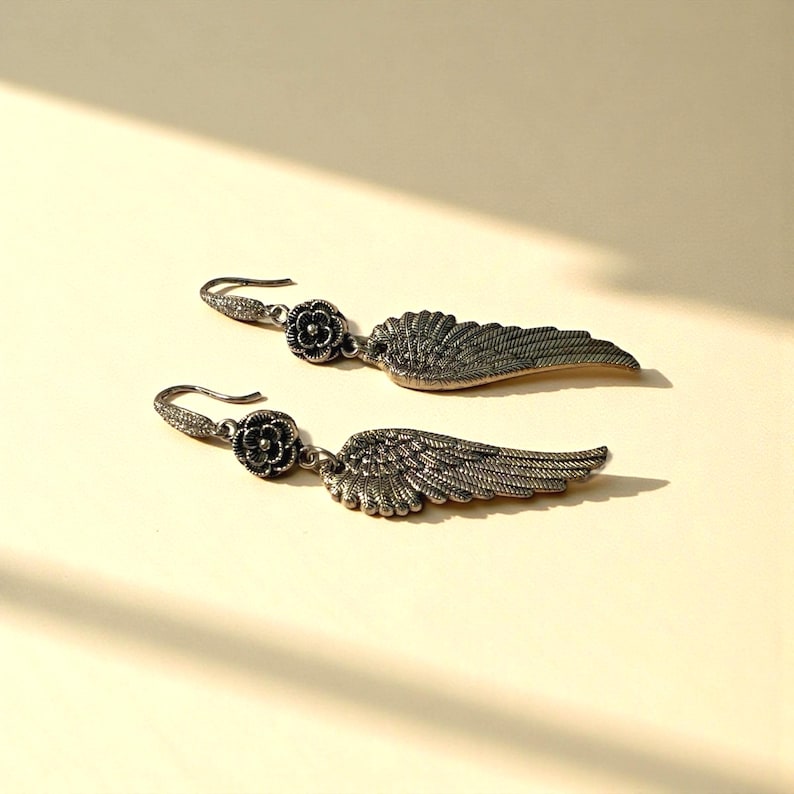 Silver Angel Wing Earring Bohemian Dangle Design Floral Charm Detail Celestial Jewelry Collection Lightweight Statement Drop Style Wedding Guest Accessory Party Wear Essential Boho Fashion Trend Special Occasion Jewelry Unique Gift Idea