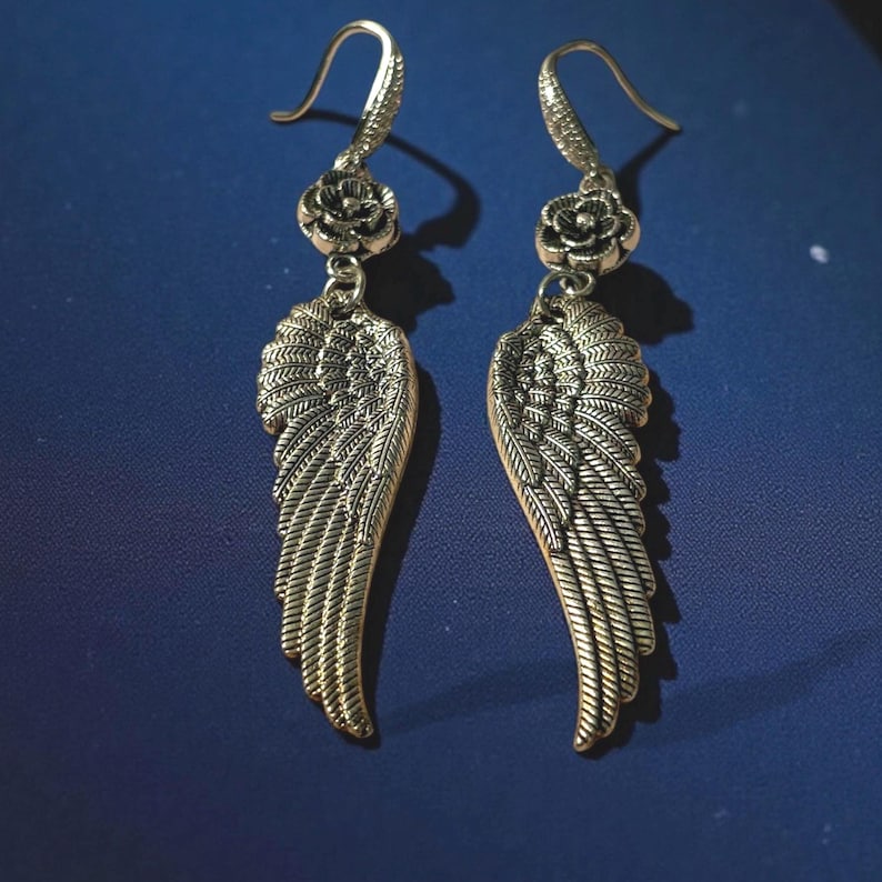 Gift Idea Collection Silver Angel Wing Earring Bohemian Dangle Design Floral Charm Accent Lightweight Statement Piece Wedding Guest Accessory Party Wear Essential Celestial Jewelry Trend Boho Style Fashion Special Occasion Must Have