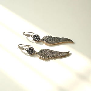 Gift Idea Collection Silver Angel Wing Earring Bohemian Dangle Design Floral Charm Accent Lightweight Statement Piece Wedding Guest Accessory Party Wear Essential Celestial Jewelry Trend Boho Style Fashion Special Occasion Must Have