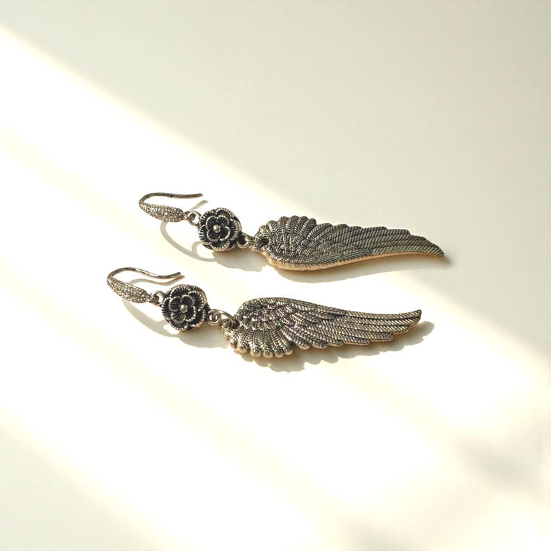 Gift Idea Collection Silver Angel Wing Earring Bohemian Dangle Design Floral Charm Accent Lightweight Statement Piece Wedding Guest Accessory Party Wear Essential Celestial Jewelry Trend Boho Style Fashion Special Occasion Must Have
