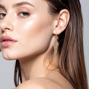 Silver Angel Wing Earring Bohemian Dangle Design Floral Charm Detail Celestial Jewelry Collection Lightweight Statement Drop Style Wedding Guest Accessory Party Wear Essential Boho Fashion Trend Special Occasion Jewelry Unique Gift Idea