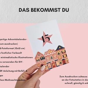 May include: A white card with a pink star and the number 15, featuring illustrated houses. Text in German reads "DAS BEKOMMST DU" and details about the advent calendar cards. The card is held against a pink background.