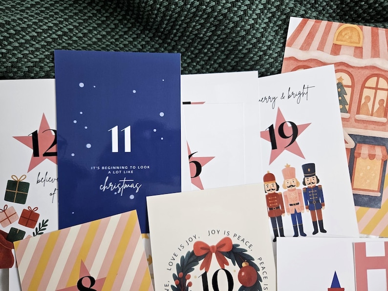 May include: A collection of Christmas-themed cards with various designs. One card is navy blue with the number 11 and the text "It's beginning to look a lot like Christmas." Other cards feature stars, gift boxes, and illustrations.