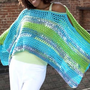 May include: A colorful crochet poncho in shades of blue, green, and white. The open-weave design features a striped pattern. The sleeves are a solid green color. The poncho is a stylish, handmade garment.