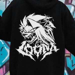May include: Black hoodie with a white graphic on the back. The graphic is a stylized illustration of a wolf-like creature with sharp teeth and the word "CORONA" in a gothic font. The hoodie has a hood and long sleeves.