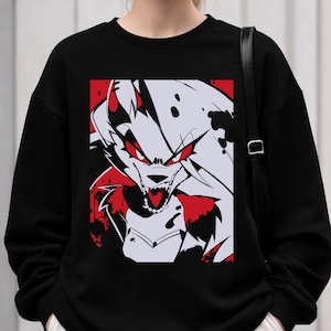 May include: Black sweatshirt featuring a graphic of a snarling wolf with red eyes and accents. The wolf design is set against a red and white background. The sweatshirt is a casual, unisex garment.